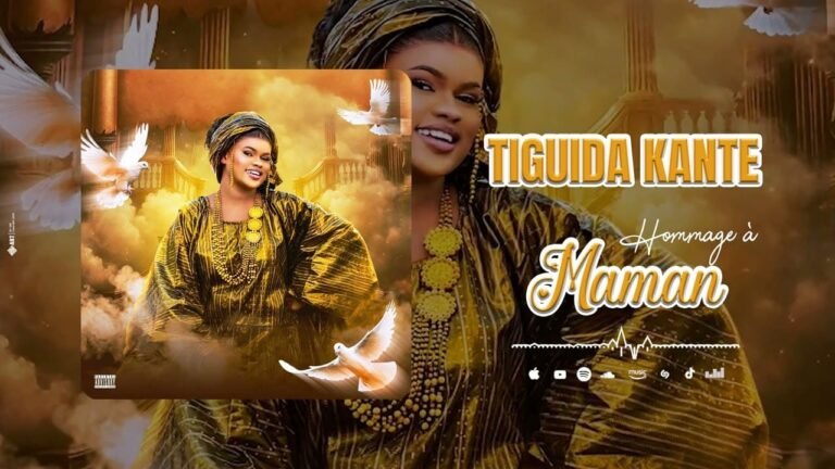 Tiguida Kanté en tenue dorée dans le clip Hommage à Maman avec des colombes symbolisant la paix