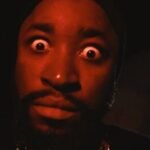 Malian lyricist DR KEB performing in his dark-themed official music video for Kabourou